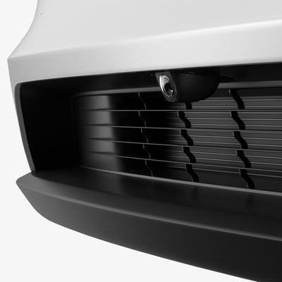 ACP11231 - Tesla Series - Front Camera Protector | TO331 showing an angled view of the front bumper camera with the protective cover installed within the grille.
