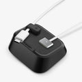 APP11145 - Magnetic Cable Holder | LD103 mounted on a light gray surface holding a MacBook charger and a white USB-C cable vertically in place