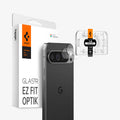 AGL08443 - Pixel 9 Case Optik EZ Fit Lens Protector in Crystal Clear showing the installation tray hovering in front of the lens protector and the device, behind it, is the packaging
