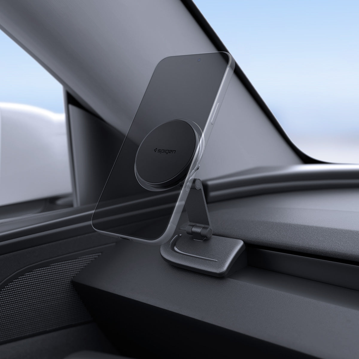 ACP11873 - Side view of the Spigen magnetic phone mount extended upward, holding a phone vertically on the dashboard