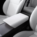 ACP12200 - Tesla Model Armrest Cover TO240H in Zen Gray showing an armrest cover installed over the center console between the front seats.