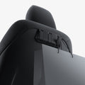 ACP09201 - Tesla Model 3 (2017-2023) Car Seat Hook TO283 in Black showing the front, partial side and bottom with 2 hook closed and 1 used for hanging paper bag