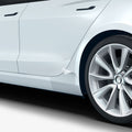 AFL06195 - Tesla Model 3 Platinum Shield Fender showing the shield peeling off slightly from car fender