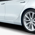 AFL06195 - Tesla Model 3 Platinum Shield Fender showing the side view with shield installed on car fender