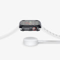 ACS01838 - Apple Watch Series (44mm) Case Ultra Hybrid in space crystal showing the side with watch hovering above the charger