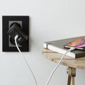 000CA25416 - DuraSync USB-C to Lightning Cable in white showing the cable connected to a wall charger and charging a phone