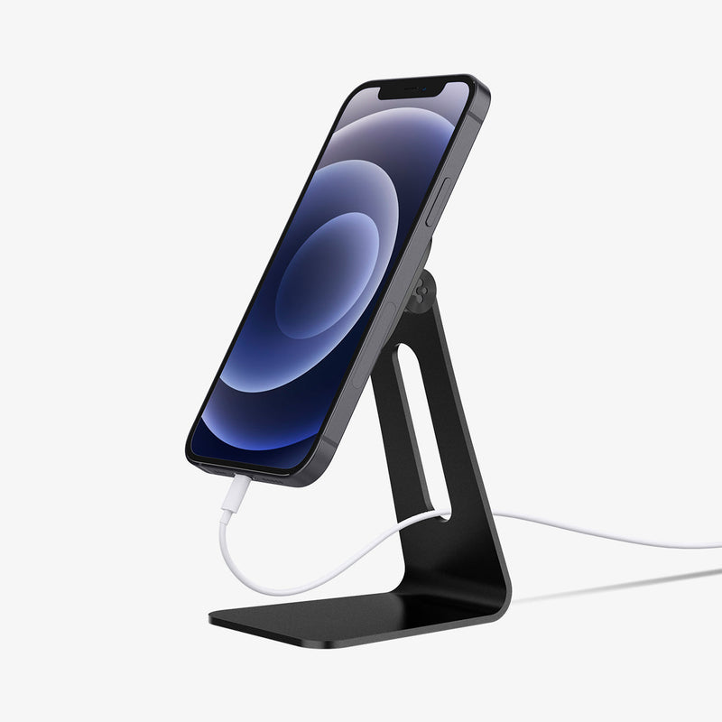 AMP02573 - OneTap Magnetic Stand in black showing the side with phone charging with cable held vertically magnetically