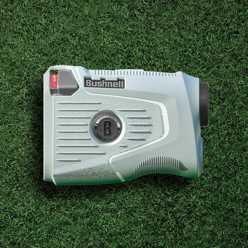 ACS06152 - Bushnell Pro X3 Rangefinder Case Silicone Fit in light gray showing the side with rangefinder on grass
