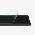 AFL04137 - Galaxy S22 Ultra 5G Screen Protector Neo Flex showing it halfway peeled to show flexibility with screen off