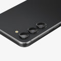 AGL05962 - Galaxy S23 Plus / S23 EZ Fit Optik Pro Lens Protector in black showing the device laying flat and zoomed in on camera lens