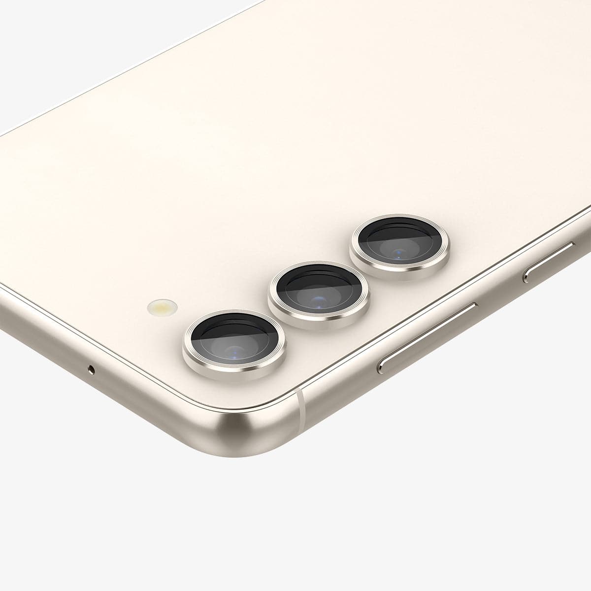 AGL06169 - Galaxy S23 Plus / S23 EZ Fit Optik Pro Lens Protector in cream showing the device laying flat and zoomed in on camera lens