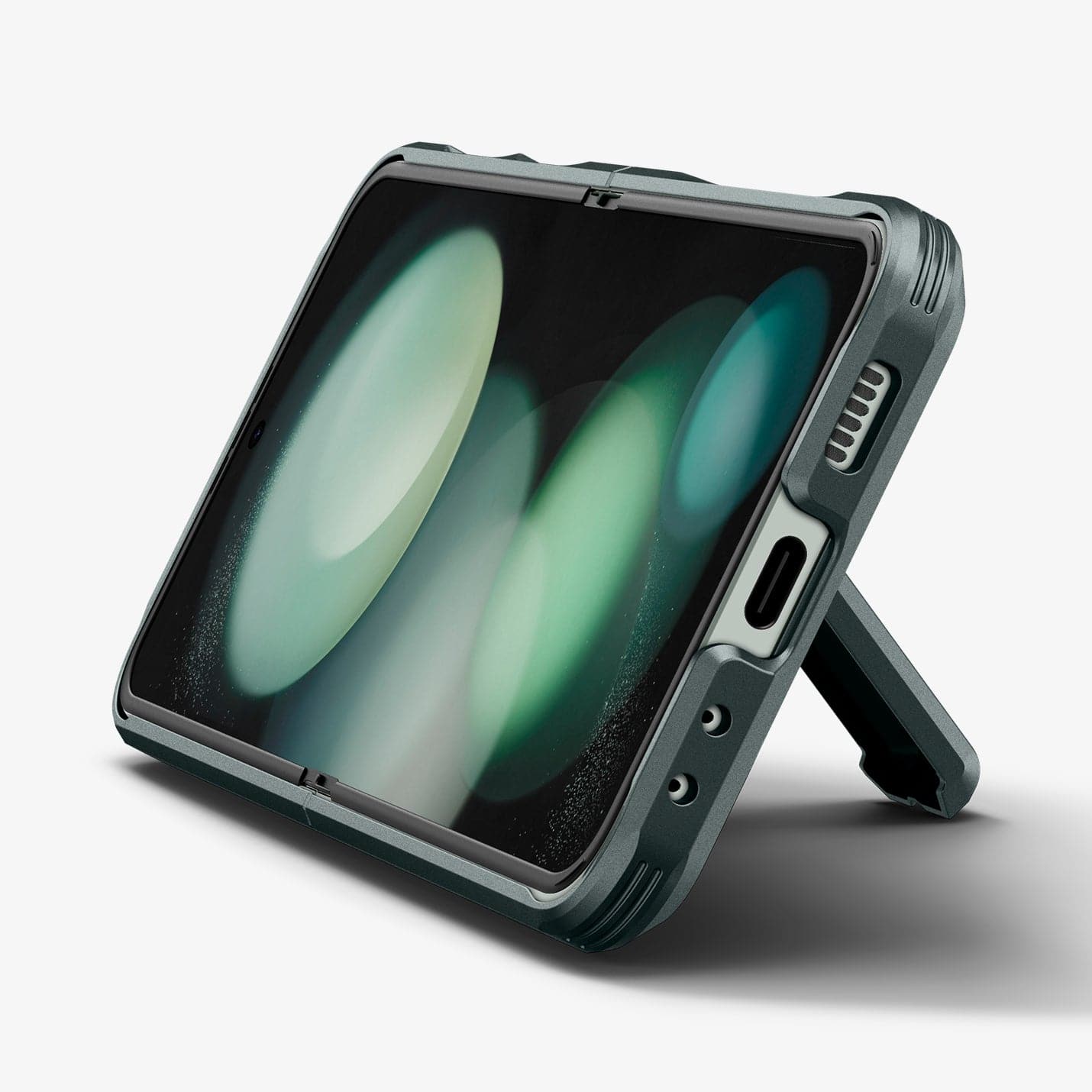 ACS06228 - Galaxy Z Flip 5 Case Tough Armor Pro in abyss green showing the front and bottom with device propped up by built in kickstand