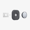 AHP02762 - Google Nest Thermostat Wall Plate in charcoal showing the multiple parts of wall cover hovering behind the google nest