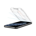 063GL25358 - iPhone 11 Pro Screen Protector GLAS.tR EZ Fit showing the device laying flat and ez fit tray with screen protector being installed