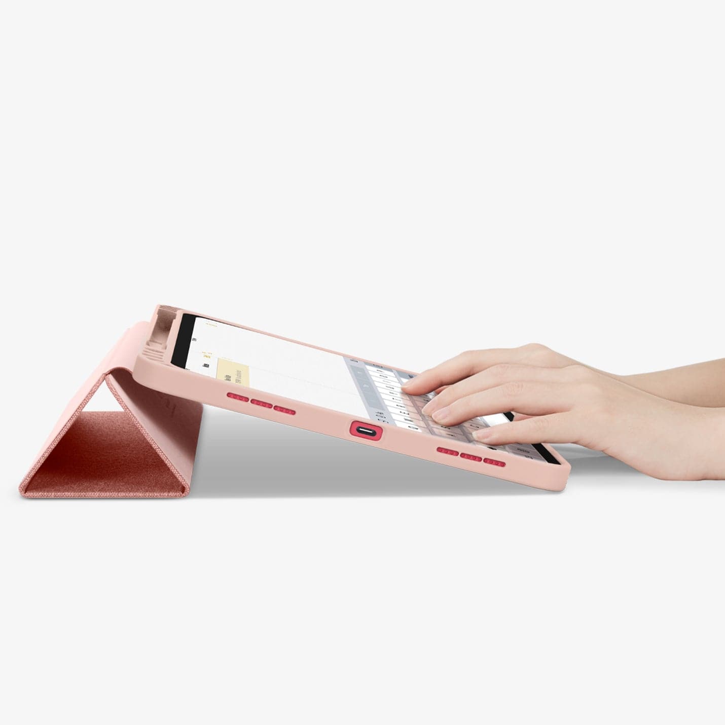 ACS05307 - iPad 10.9" Case Urban Fit in rose gold showing the bottom and partial front with device propped up and hands typing on screen