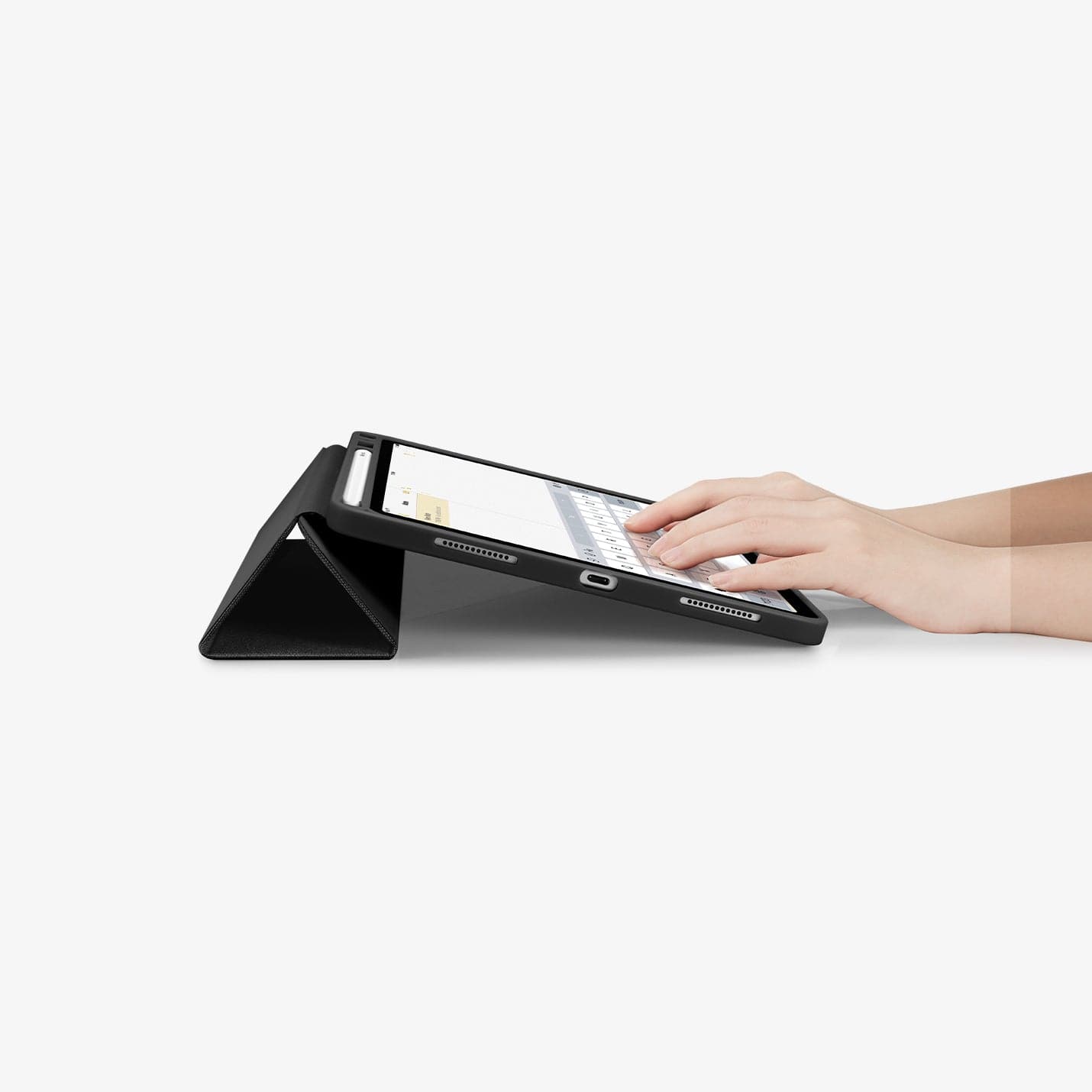 ACS01943 - iPad Air 10.9" Case Urban Fit in black showing hands typing on screen with device propped up by built in kickstand