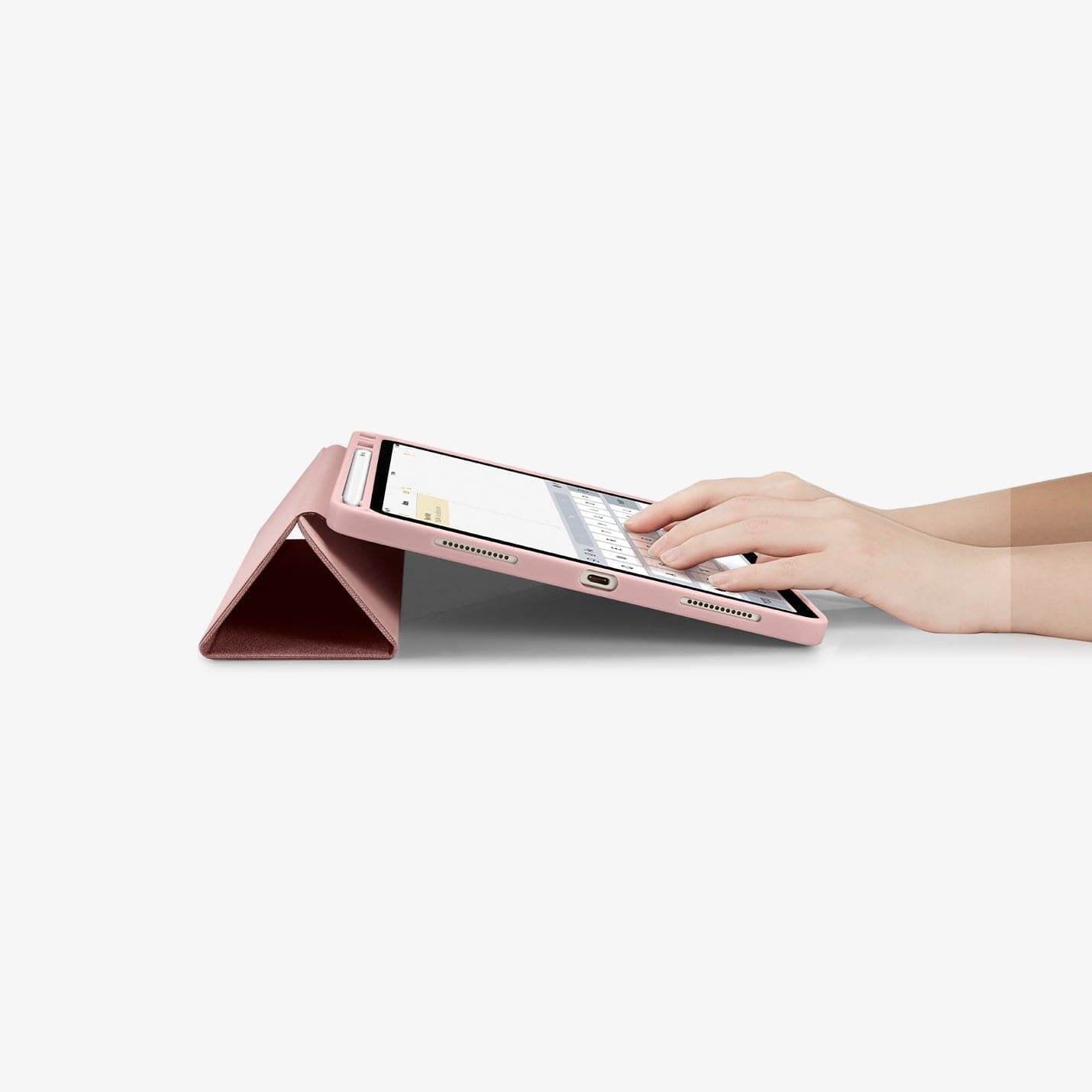 ACS01944 - iPad Air 10.9" Case Urban Fit in rose gold showing hands typing on screen with device propped up by built in kickstand