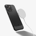 ACS04956 - iPhone 14 Pro Case Rugged Armor (MagFit) in matte black showing the back with magsafe charger hovering away from device