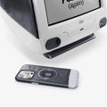 ACS06742 - iPhone 15 Pro Case Classic C1 (MagFit) in graphite showing the case laying beside an old model of mac