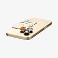 AGL05598 - iPhone 14 Pro / 14 Pro Max Optik Pro Lens Protector in gold showing the back with device laying flat and lens protector and ez fit tray hovering slightly above camera lens