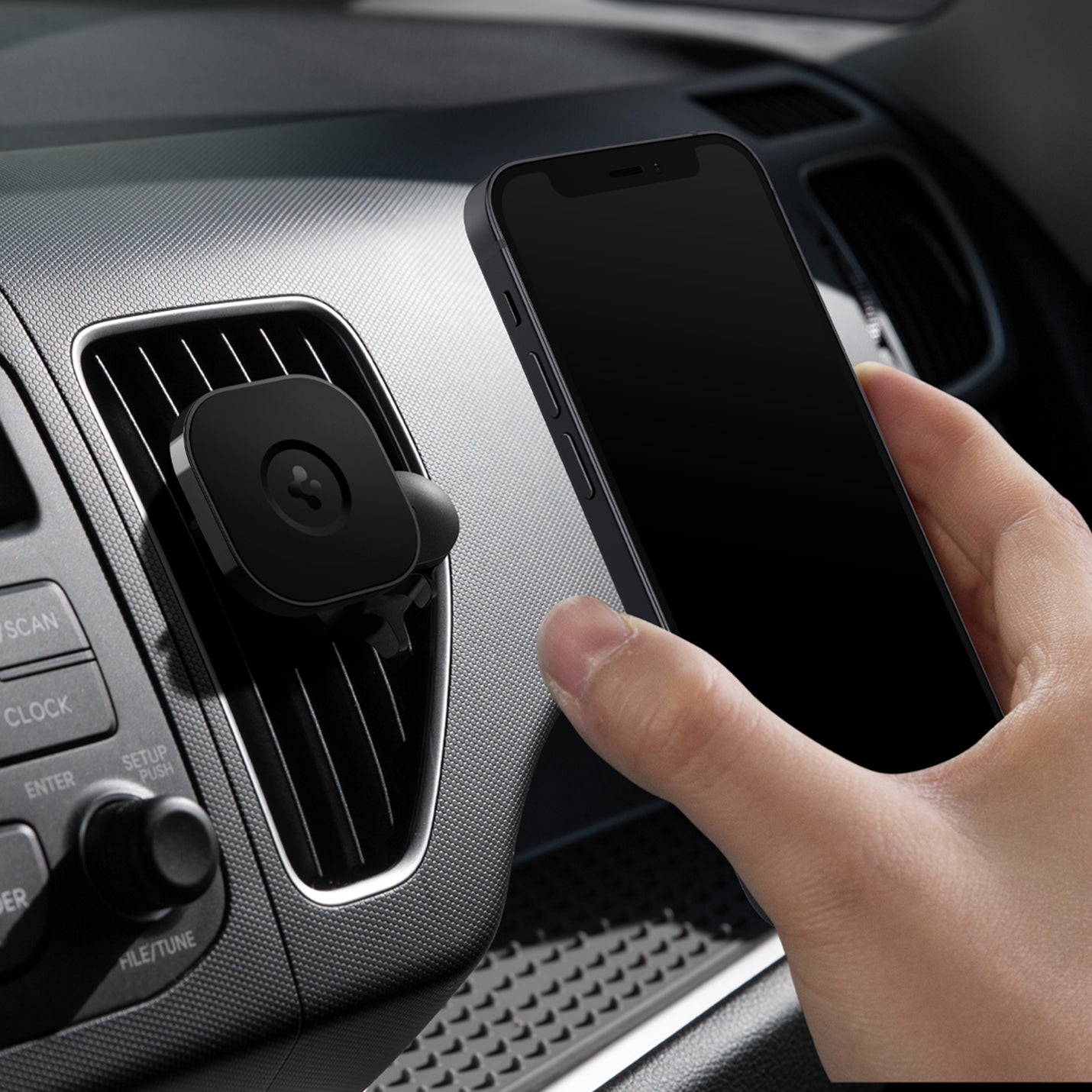 ACP02617 - OneTap Magnetic Car Mount Air Vent (MagFit) in black showing a hand placing a device on air vent mount inside of car