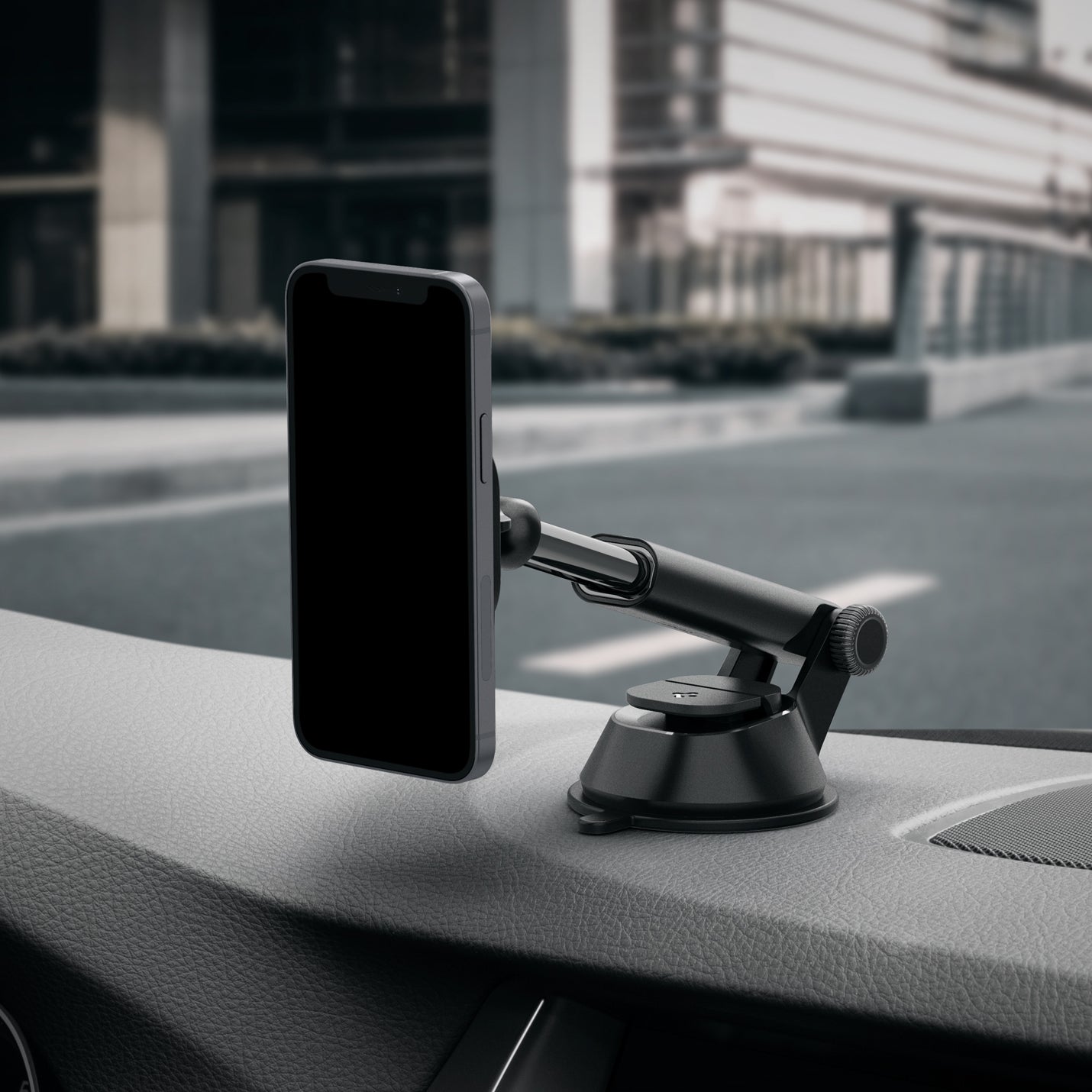 ACP02618 - OneTap Magnetic Car Mount Dashboard (MagFit) in black showing the side view of car mount on dashboard inside of vehicle with device attached