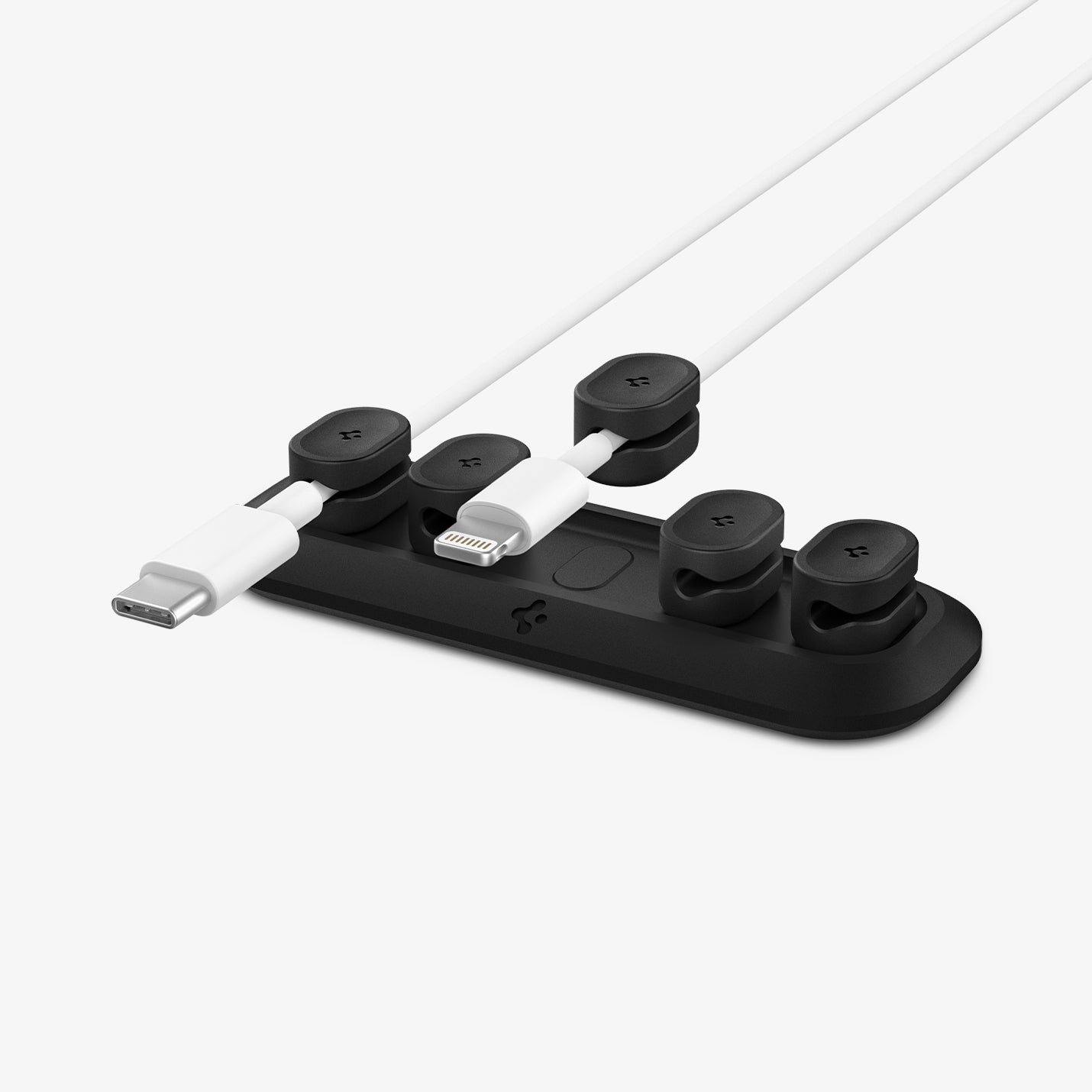 ACA04604 - LD101 Magnetic Cable Holder in black showing magnetic base with 4 cable holders and two cables using the holders with 1 hovering above base