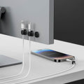 AMP05487 - LD102 Singular Magnetic Cable Organizer in black showing the cable holders mounted behind monitor with cables inserted