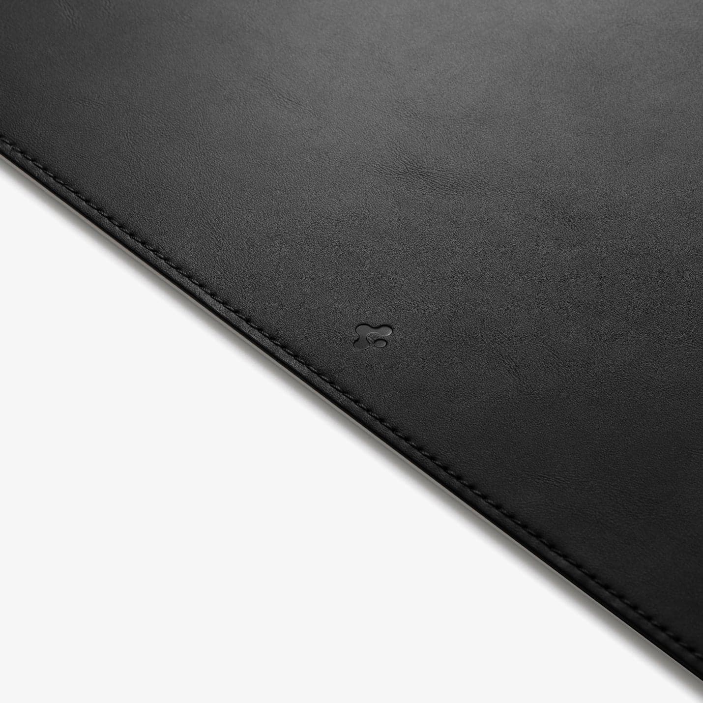 APP04760 - LD301 Mousepad in black showing the bottom zoomed in on Spigen logo
