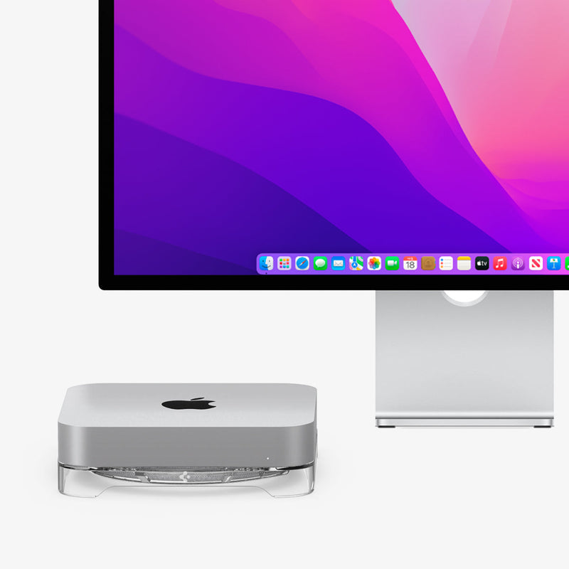 AMP06150 - Apple Mac Mini Stand in crystal clear showing the front and side with stand next to monitor