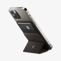 AMP02766 - MagSafe Card Holder Smart Fold Wallet (MagFit) in gunmetal showing the stand attached to device and propped up by built in stand