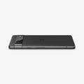 AGL05970 - Pixel 7a Glas.tR EZFit Optik Lens Protector in black showing the side and back with device laying flat