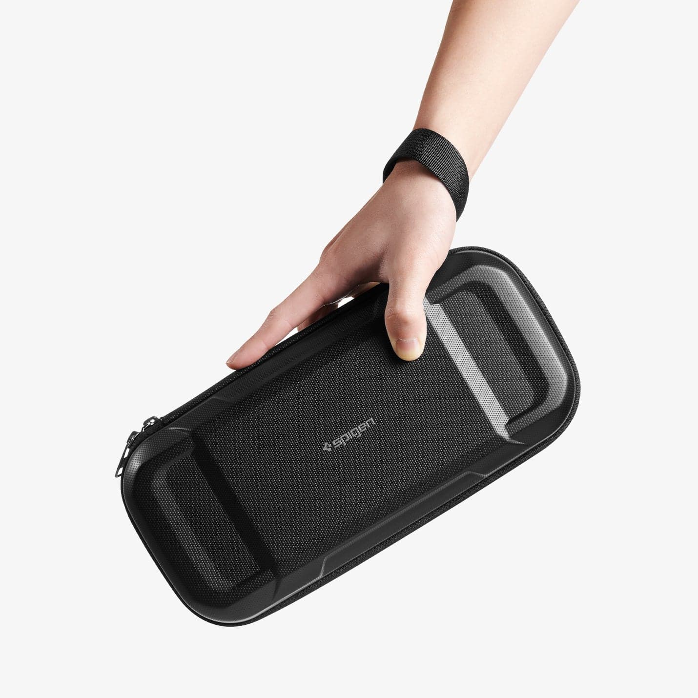 AFA04021 - Nintendo Switch OLED Rugged Armor Pro Pouch in matte black showing the carrying case in someone's hand and strap around the wrist