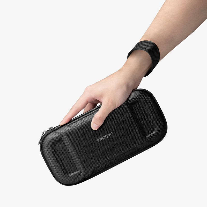 AFA04750 - Nintendo Switch Rugged Armor Pro Pouch in matte black showing a hand holding the pouch and strap around the wrist