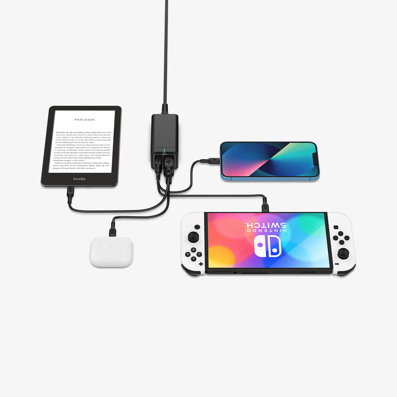 ACH03787 - Spigen ArcDock 65W Desktop Charger PD2101 in black showing the charger connected to a tablet, airpods, phone and nintendo switch at the same time charging