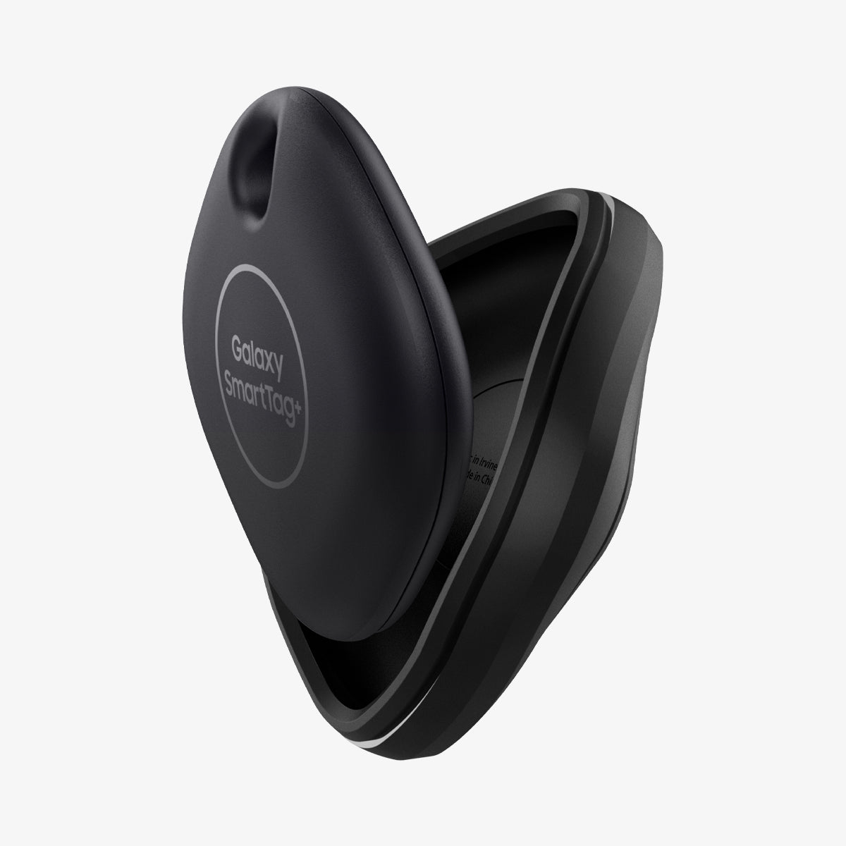 ACS03411 - Galaxy SmartTag+ Case Rugged Armor in matte black showing the smarttag being put into case