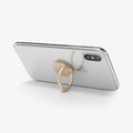 000SR24437 - Style Ring 360 in champagne gold showing the phone propped up by ring attached to back of device