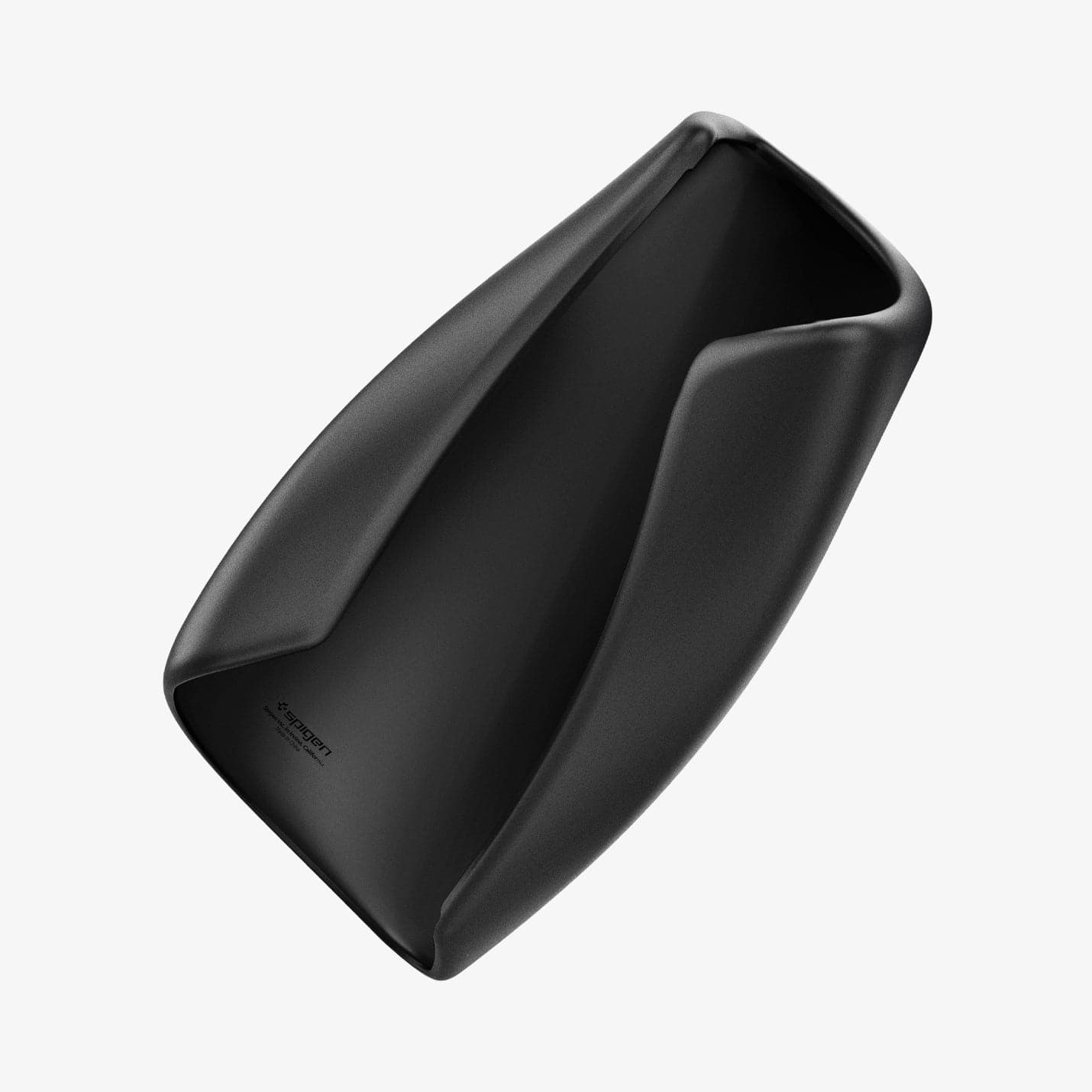 ACP06042 - Tesla Model 3 & Y Armrest Cover in black showing the cover bending to show the flexibility