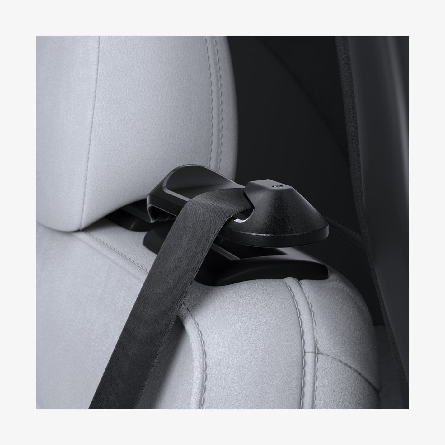 ACP06041 - Tesla Model Y Backseat Seatbelt Guide in black showing the guide with seatbelt installed inside vehicle
