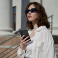 ACS05609 - Galaxy S23 Ultra Case Thin Fit in black showing a woman outside with device in hand