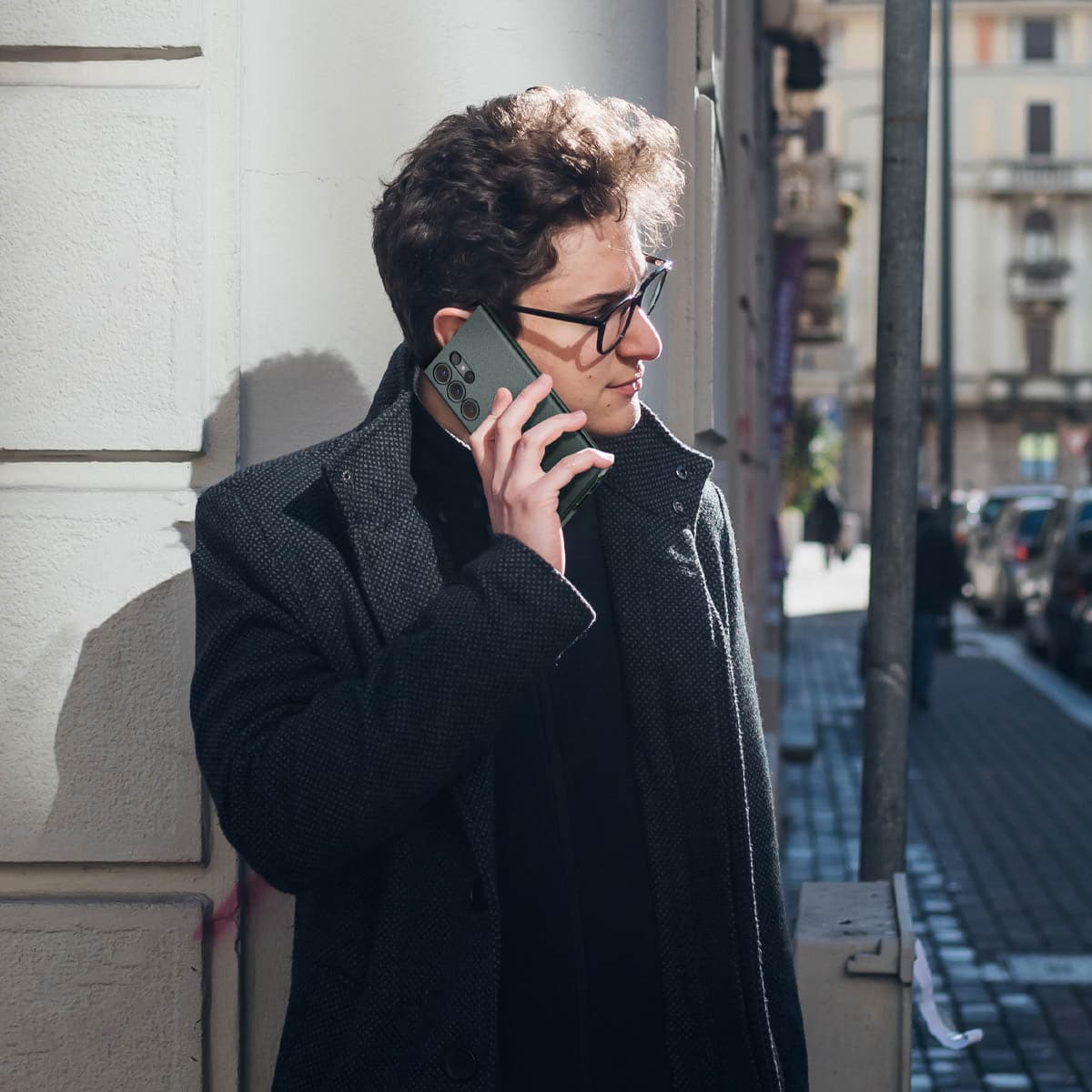 ACS06077 - Galaxy S23 Ultra Case Thin Fit in abyss green showing a man standing outside talking on phone in hand
