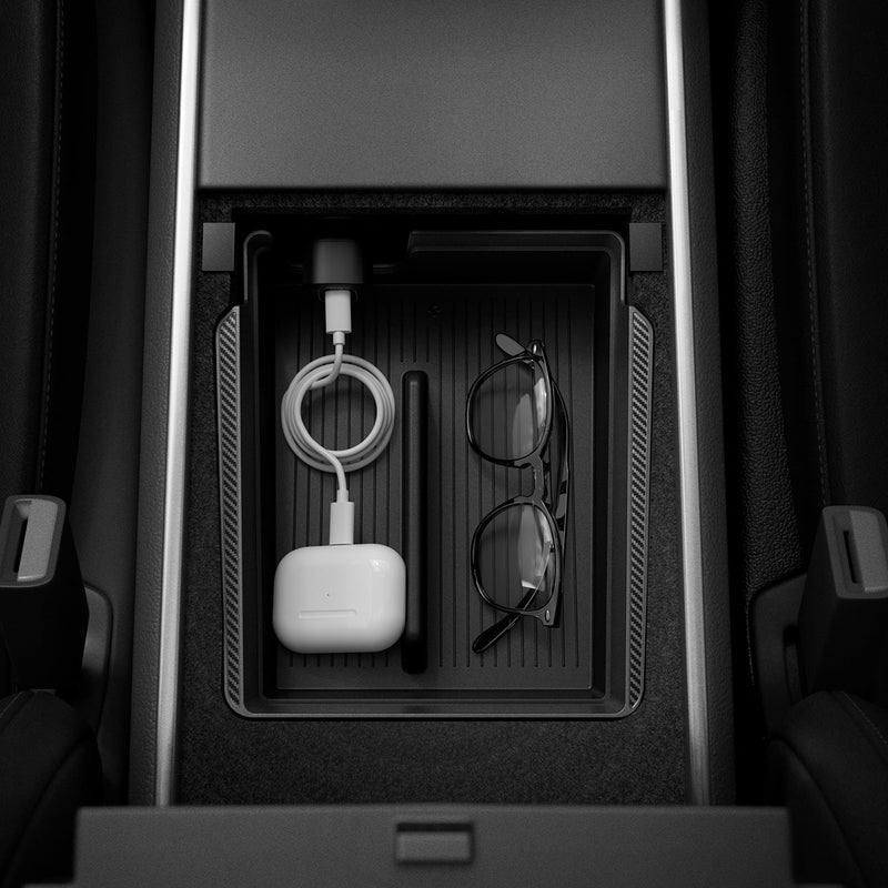 ACP06258 - Tesla Model 3 & Y Armrest Console Organizer in black showing the top view inside of car with sunglasses and airpods charging