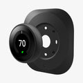 AHP03711 - Google Nest Learning Thermostat 3G Wall Plate in black showing the google nest hovering in front of wall plate