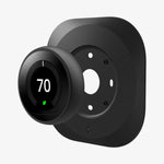 AHP03711 - Google Nest Learning Thermostat 3G Wall Plate in black showing the google nest hovering in front of wall plate