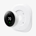 AHP03710 - Google Nest Learning Thermostat 3G Wall Plate in white showing the google nest hovering in front of the wall plate