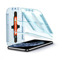 063GL25358 - iPhone XS / X Screen Protector GLAS.tR EZ Fit showing the device, ez fit tray and two screen protectors