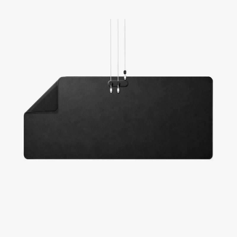 APP05267 - LD302M Magnetic Desk Pad in black showing the top left corner slightly folded and magnetic cable organizer on desk pad with cables inserted